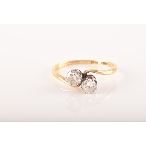 9 - A 18ct yellow gold and platinum two stone ring, set with two brilliant cut diamonds, approximately I... 