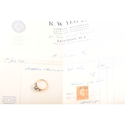 57 - An 18ct yellow gold three stone sapphire and diamond ring, set to centre with an oval sapphire with ... 