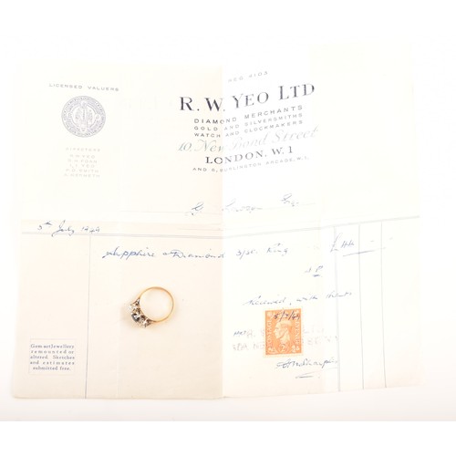 57 - An 18ct yellow gold three stone sapphire and diamond ring, set to centre with an oval sapphire with ... 