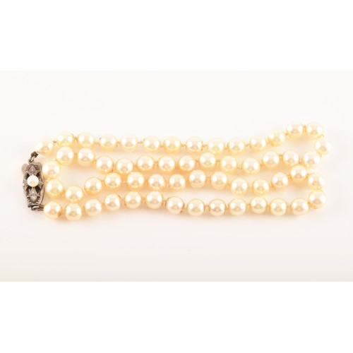 58 - A pearl necklace with silver metal decorated clasp, approximately 8 inches in length, a 9ct yellow g... 