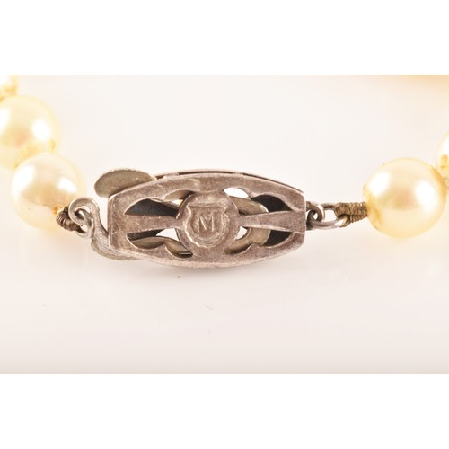 58 - A pearl necklace with silver metal decorated clasp, approximately 8 inches in length, a 9ct yellow g... 