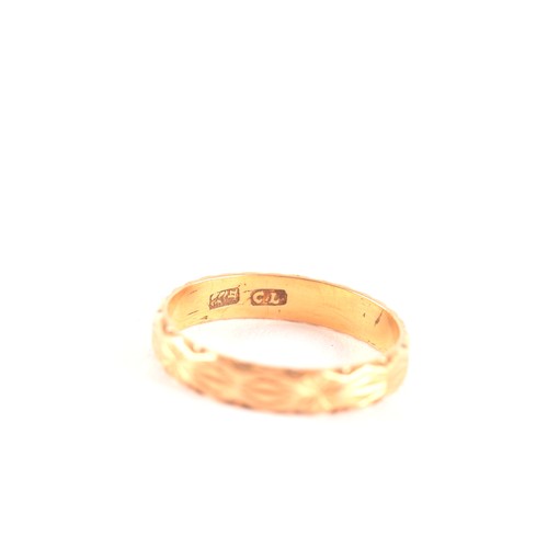 47 - A yellow gold engraved wedding band, size K, along with a yellow metal pin brooch, measuring approxi... 