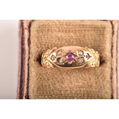 48 - A Victorian 15ct yellow gold ring featuring a ruby to the centre, surrounded by seed pearls, size N,... 