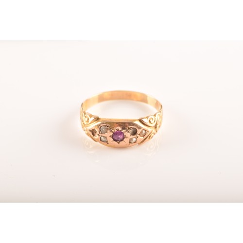 48 - A Victorian 15ct yellow gold ring featuring a ruby to the centre, surrounded by seed pearls, size N,... 