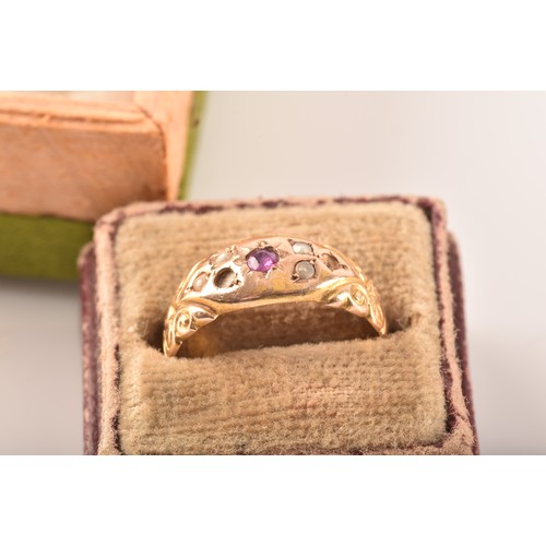 48 - A Victorian 15ct yellow gold ring featuring a ruby to the centre, surrounded by seed pearls, size N,... 