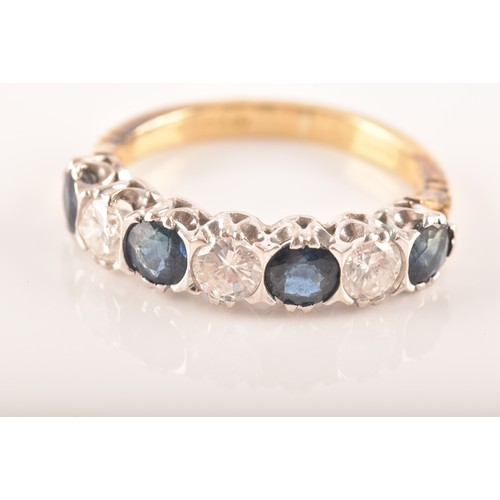 49 - An 18ct yellow gold, diamond, and sapphire ring, set with three round brilliant-cut diamonds and fou... 