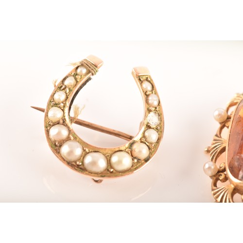 89 - A 14ct yellow gold citrine and pearl brooch, along with a yellow metal horse shoe pearl brooch, and ... 