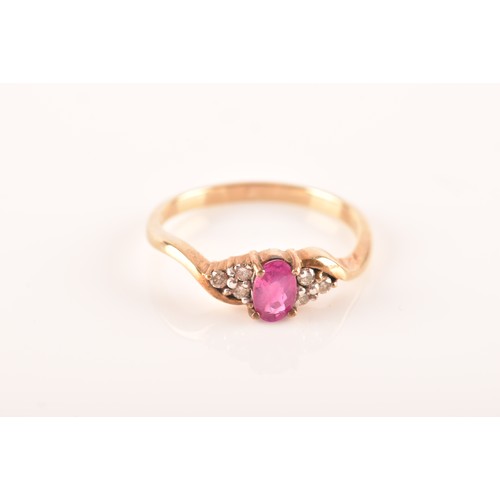 81 - A 9ct yellow gold ring, set to centre with an oval ruby with an approximate weight of 0.50 carats as... 