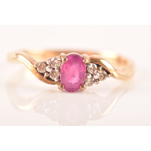 81 - A 9ct yellow gold ring, set to centre with an oval ruby with an approximate weight of 0.50 carats as... 