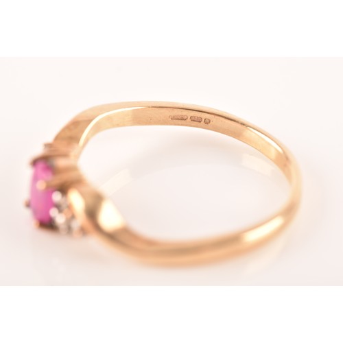 81 - A 9ct yellow gold ring, set to centre with an oval ruby with an approximate weight of 0.50 carats as... 