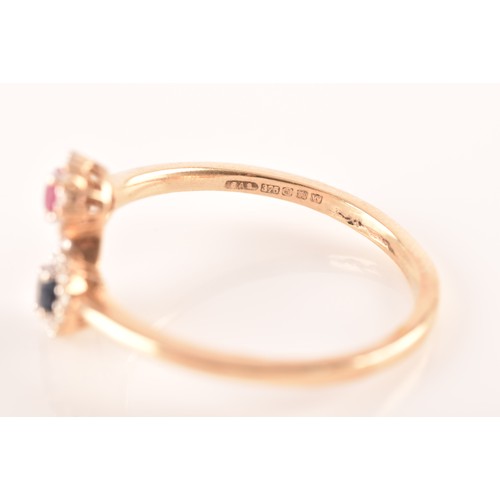 81 - A 9ct yellow gold ring, set to centre with an oval ruby with an approximate weight of 0.50 carats as... 