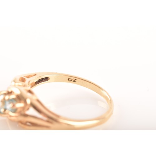 82 - A 9ct gold and blue topaz ring, full hallmarks for London, size N1/2, and a 9ct yellow gold and blue... 