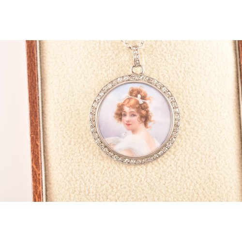 90 - An Edwardian painted porcelain pendant, surrounded by round eight cut diamonds with a millegrain bor... 