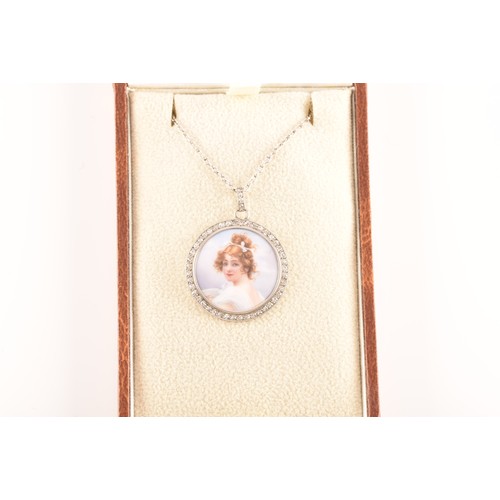 90 - An Edwardian painted porcelain pendant, surrounded by round eight cut diamonds with a millegrain bor... 