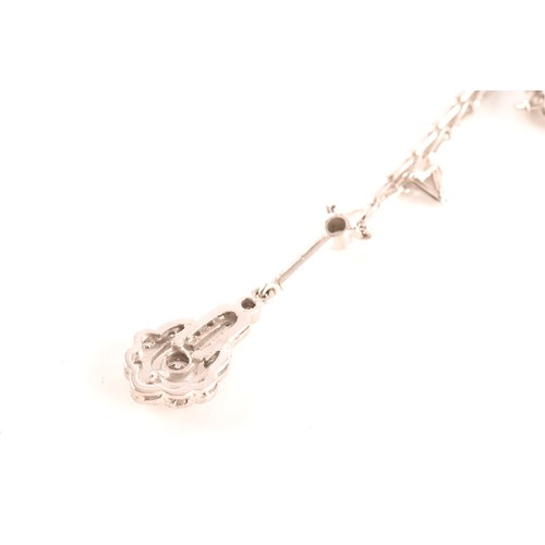 29 - An 18ct white gold drop pendant, featuring a brilliant cut diamond to the centre with an approximate... 