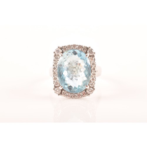 31 - A platinum cluster ring, set to centre with an oval aquamarine with an approximate weight of 7.60 ca... 