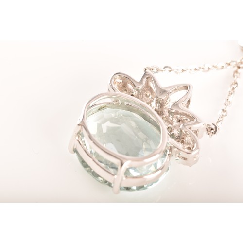 11 - A platinum pendant and chain, featuring an oval aquamarine with an approximate weight of 12.00 carat... 