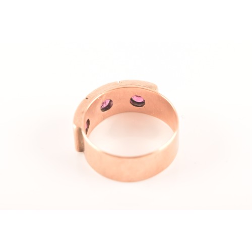 34 - A 9ct rose gold gypsy ring, featuring three almandine garnets with an approximate weight of 0.30 car... 