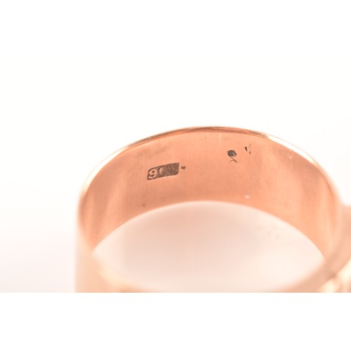 34 - A 9ct rose gold gypsy ring, featuring three almandine garnets with an approximate weight of 0.30 car... 