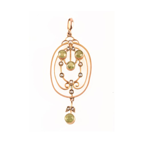 97 - An Edwardian yellow metal, peridot, and split seed pearl pendant, in the Art Nouveau taste, the oval... 