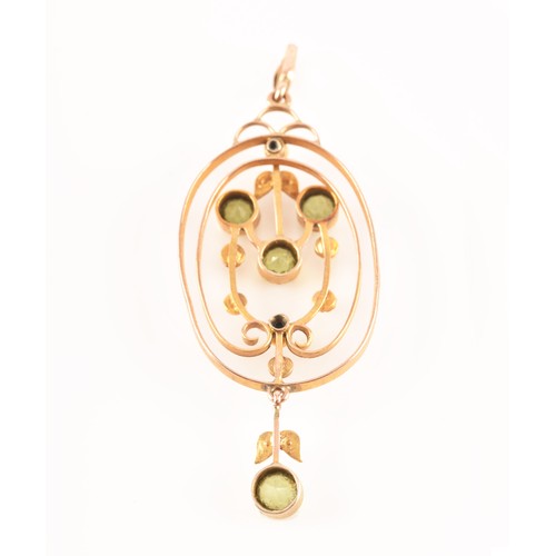 97 - An Edwardian yellow metal, peridot, and split seed pearl pendant, in the Art Nouveau taste, the oval... 