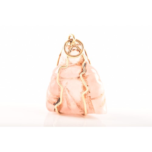 84 - A yellow metal mounted rose quartz Buddha pendant, unmarked, together with a 9ct yellow gold and ame... 