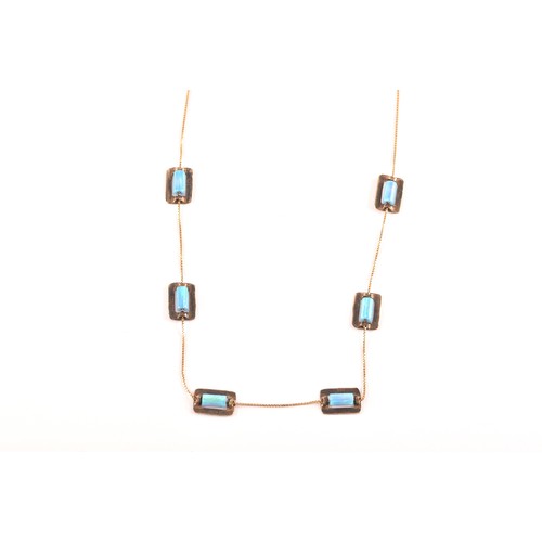 85 - A 9ct yellow gold and opal necklace, set with six rolled opal beads each in a rectangular gold mount... 