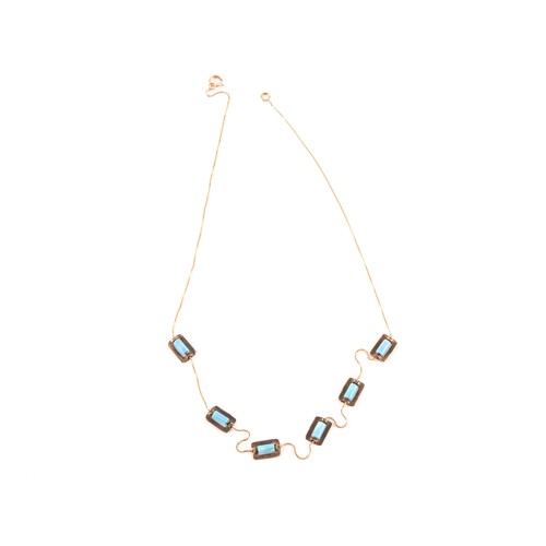 85 - A 9ct yellow gold and opal necklace, set with six rolled opal beads each in a rectangular gold mount... 