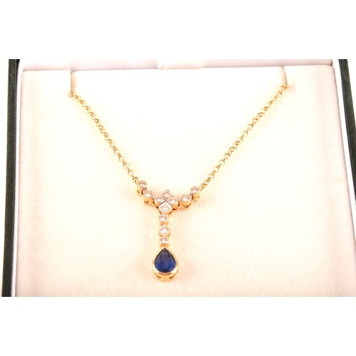 93 - An 18ct yellow gold sapphire and diamond necklace, featuring a pear cut sapphire with an approximate... 