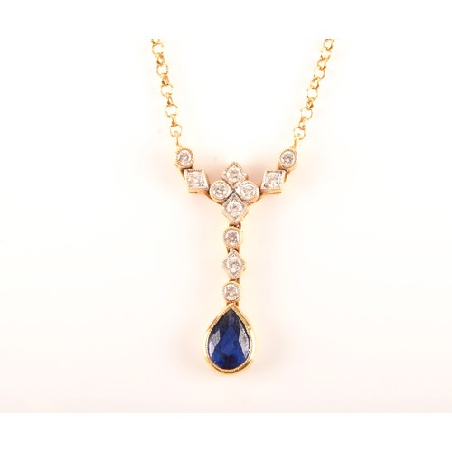 93 - An 18ct yellow gold sapphire and diamond necklace, featuring a pear cut sapphire with an approximate... 