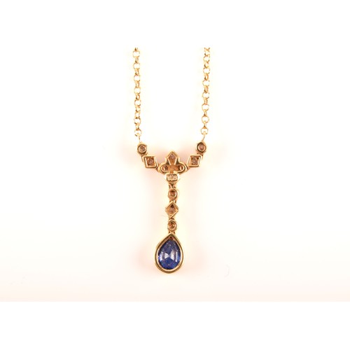 93 - An 18ct yellow gold sapphire and diamond necklace, featuring a pear cut sapphire with an approximate... 