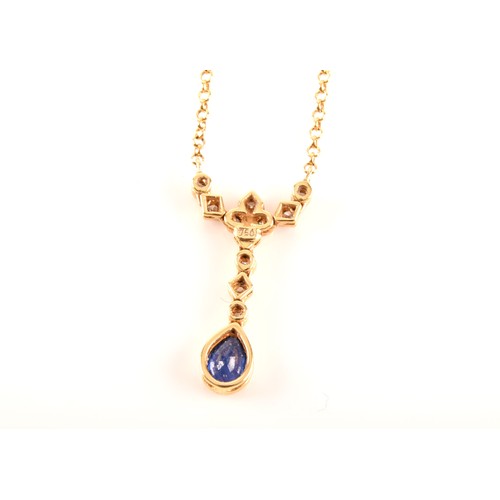 93 - An 18ct yellow gold sapphire and diamond necklace, featuring a pear cut sapphire with an approximate... 