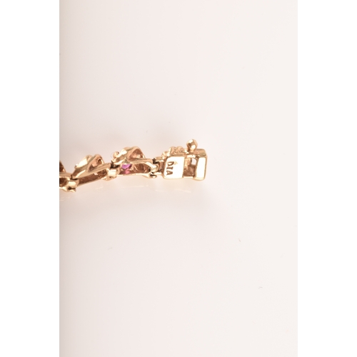 16 - A ruby and diamond 9ct yellow gold line bracelet, set with sixteen round rubies with a combined appr... 