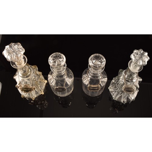 300 - Two pairs of 19th century cut lead glass decanters and stoppers, with silver plated decanter labels ... 