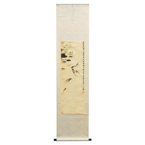 249 - A Chinese scroll depicting fish in a pond with lily pads, with Chinese character marks and two red s... 