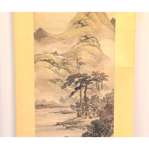 250 - A mid 20th century Chinese painted scroll, depicting an extensive landscape scene with trees and bui... 