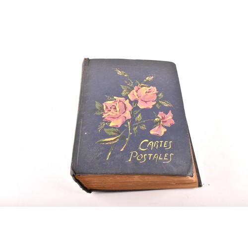 312 - Postcards. Two early 20th century postcard albums, with postcards of a variety of topics including i... 