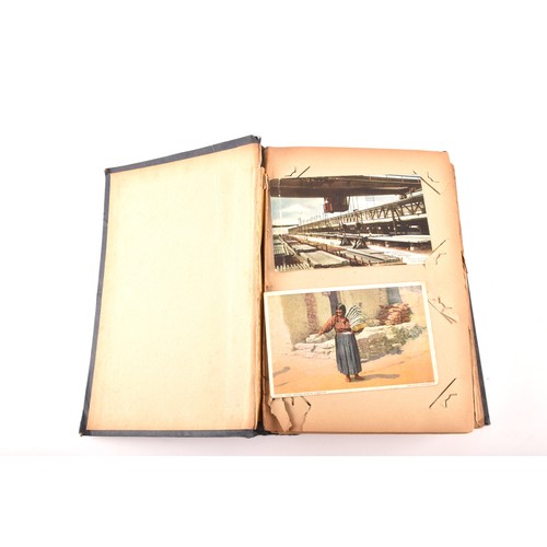 312 - Postcards. Two early 20th century postcard albums, with postcards of a variety of topics including i... 