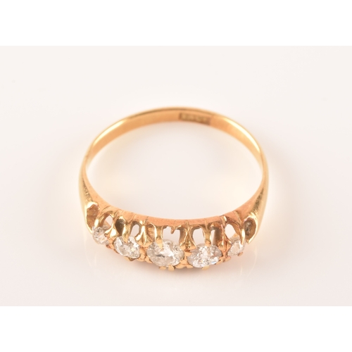 18 - A late 19th / early 20th century 18ct yellow gold and diamond ring, set with five graduated old-cut ... 