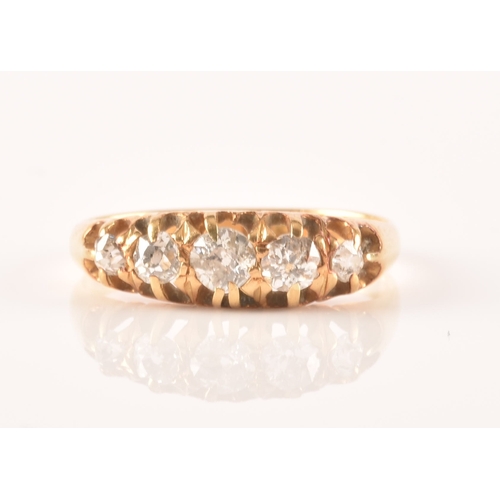 18 - A late 19th / early 20th century 18ct yellow gold and diamond ring, set with five graduated old-cut ... 