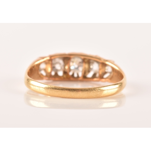 18 - A late 19th / early 20th century 18ct yellow gold and diamond ring, set with five graduated old-cut ... 