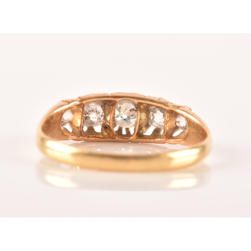 18 - A late 19th / early 20th century 18ct yellow gold and diamond ring, set with five graduated old-cut ... 