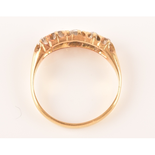 18 - A late 19th / early 20th century 18ct yellow gold and diamond ring, set with five graduated old-cut ... 