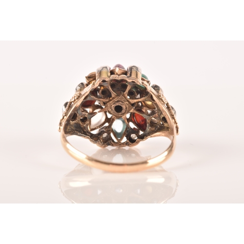 26 - A yellow metal, diamond, and multi-gem princess ring, of domed design, set with garnet, tigers eye, ... 