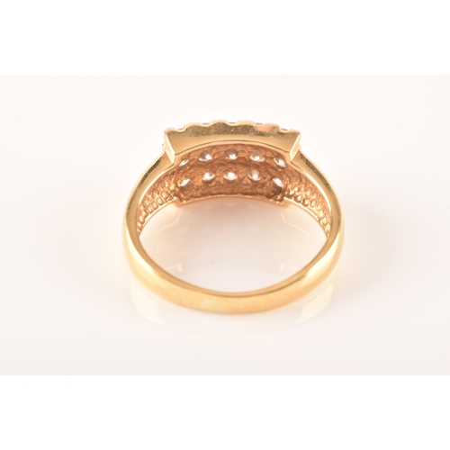 71 - An 18ct yellow gold and moissonite ring, set with fifteen round brilliant-cut moissonite, the ring h... 