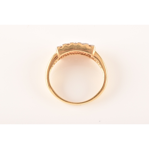 71 - An 18ct yellow gold and moissonite ring, set with fifteen round brilliant-cut moissonite, the ring h... 