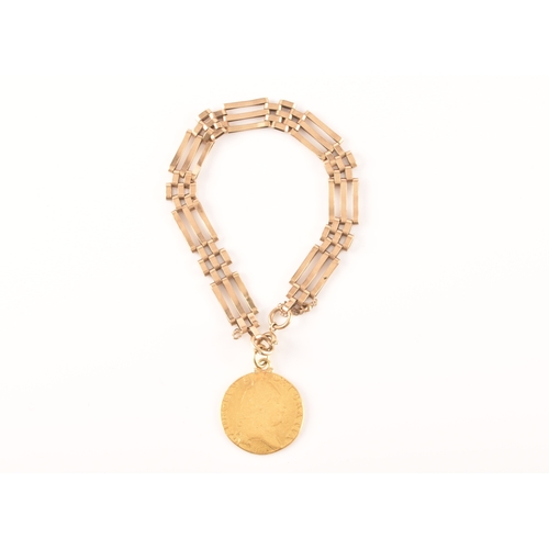 52 - A 9ct yellow gold gate-link bracelet, suspended with a George III spade guinea coin, the bracelet ma... 