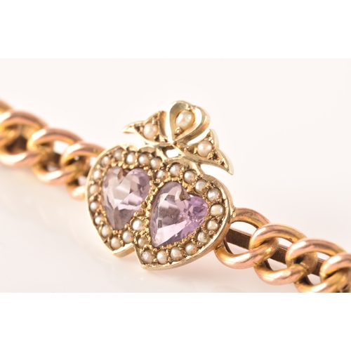 20 - A 9ct yellow gold and amethyst brooch, in a Celtic style, set with a large round-cut pale lilac amet... 