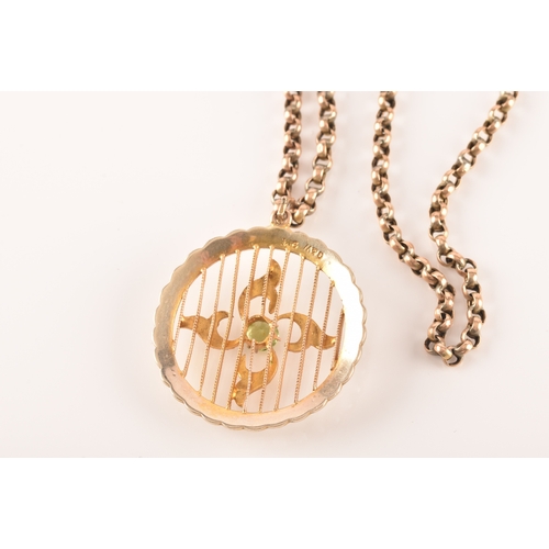 21 - An Edwardian 9ct yellow gold, peridot, and split seed pearl pendant, centred with quatrefoil design ... 