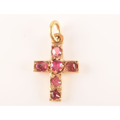 69 - A yellow metal and red stone clover bar brooch, set with two stones, unmarked, 1.7 cm long, together... 